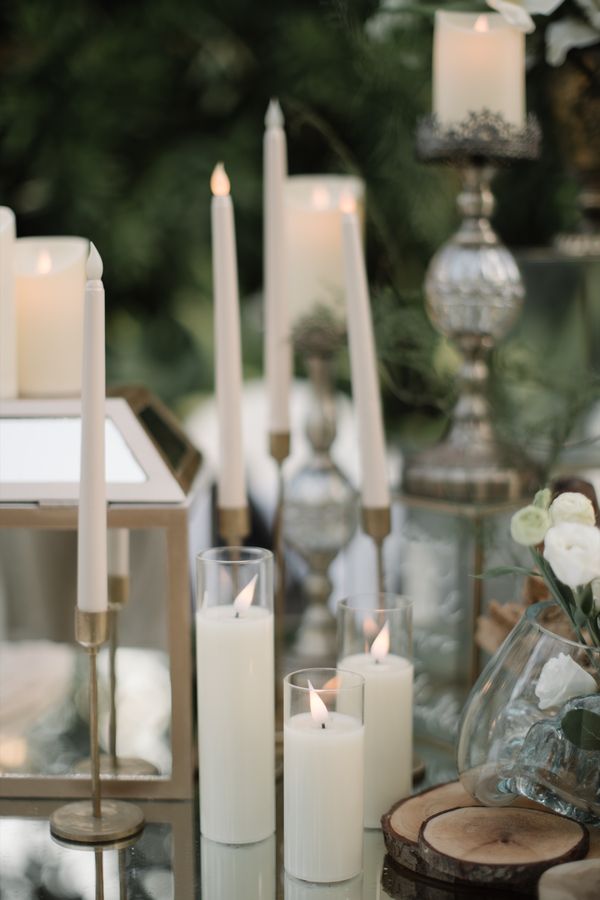 Tall taper candles across the reception