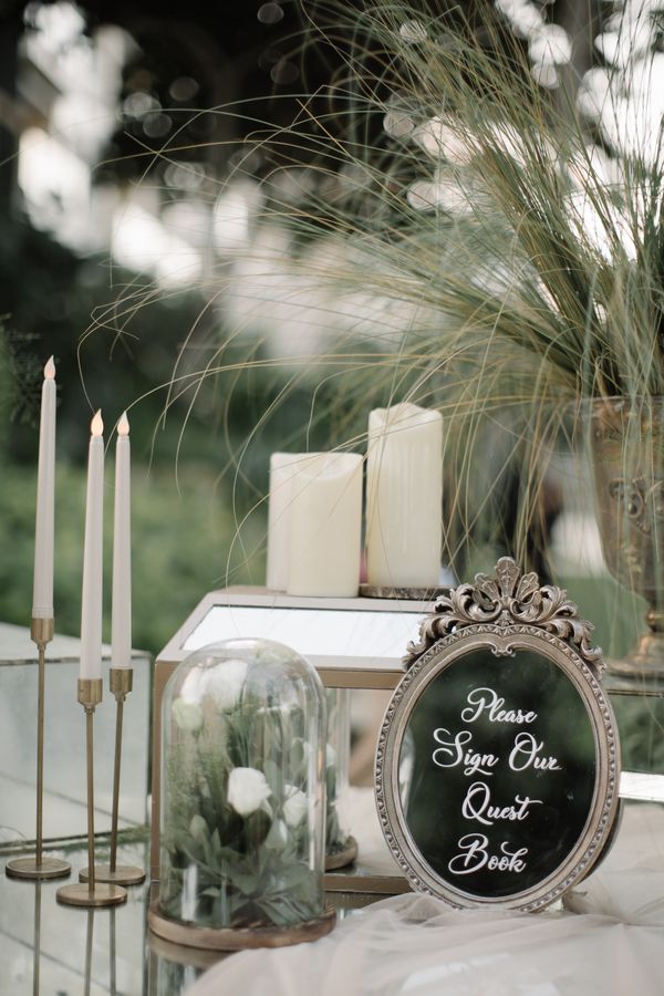Candlelit reception details and signage