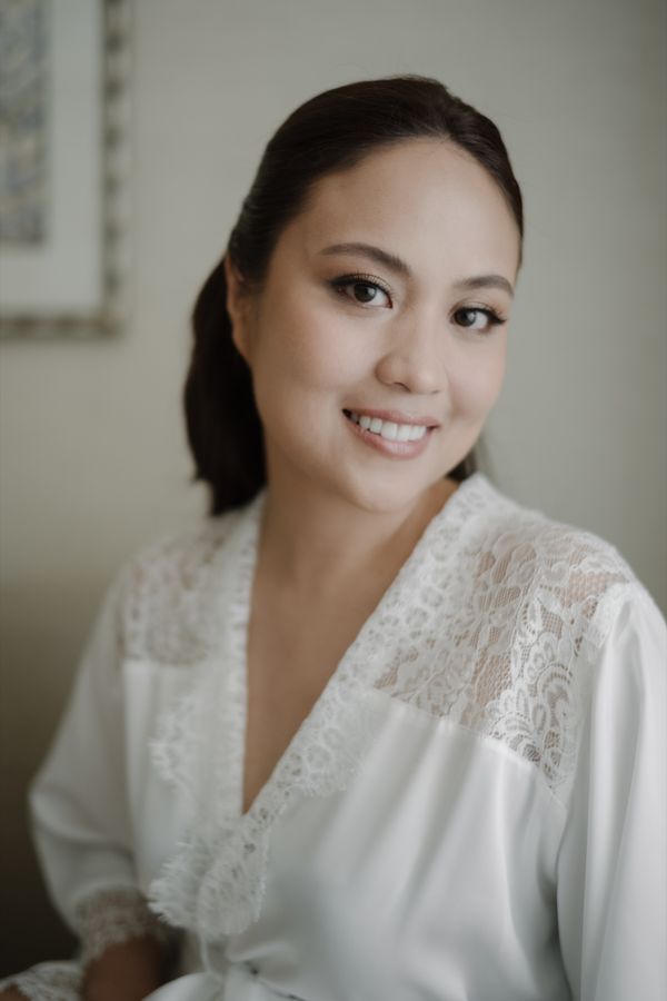 A bride photographed in soft light on her wedding day