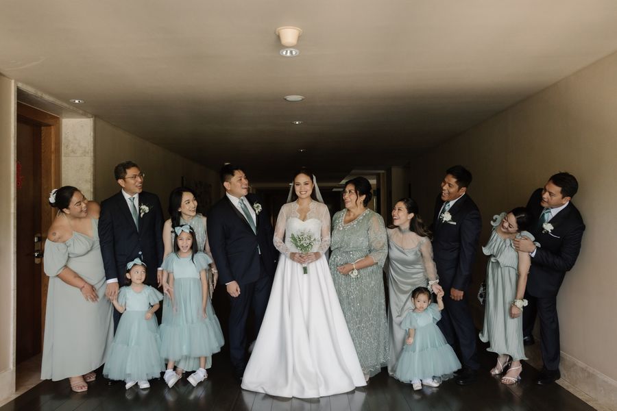 The full wedding party in sage and navy